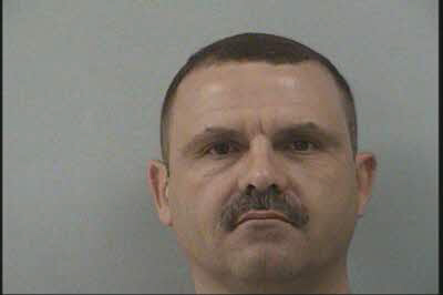 Two charged after officers find gun